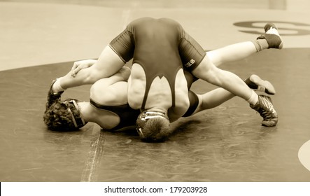 Two Men Battle For Control In Wrestling Match