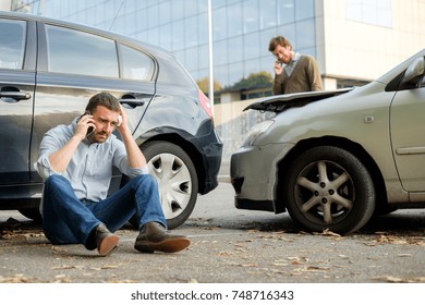 Two Men Calling Car Help Assistance After An Accident