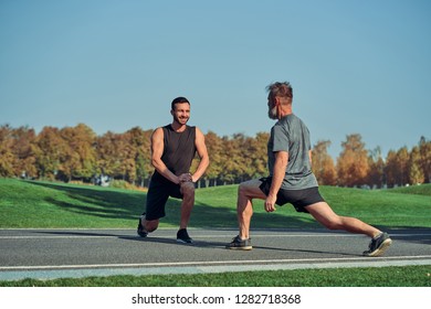 The two men doing exercise outdoor - Powered by Shutterstock