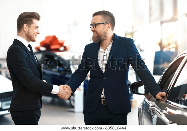 Two Men Handshaking Car Dealership Stock Photo 635816444 | Shutterstock