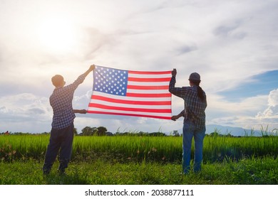 Two Men Holding United States Of America Flag (USA) For 4th Labor Day Concept.