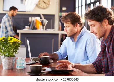 Two Men Meeting At A Coffee Shop