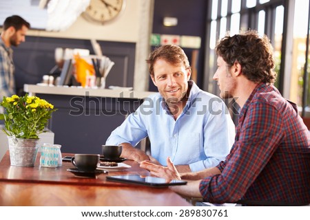 Two men meeting at a coffee shop