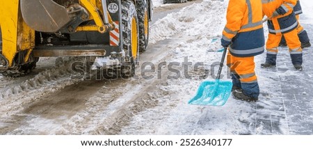 Similar – Image, Stock Photo A man clears snow from a street with a snow shovel