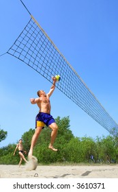 Two Men Playing Beach Volleyball - Fat Man Jumps Nicely To Push The Ball, Other Man 