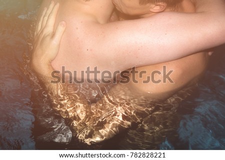 Two men in the pool. Love and romance. 