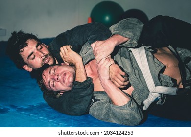 Two men practising brazilian jiu-jitsu