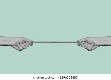 two men pulling each of the opposite ends of a rope in black and white, on a pale green background