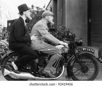 Two men riding a motorbike - Powered by Shutterstock