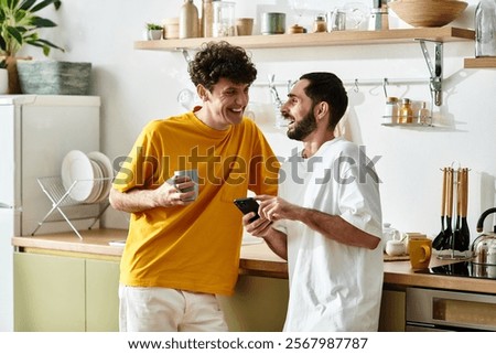 Two men sharing laughter and warmth while enjoying each others company at home.