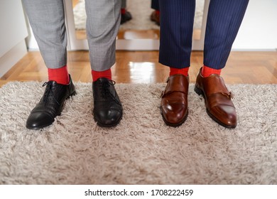 Two Men In Shoes And Red Socks
