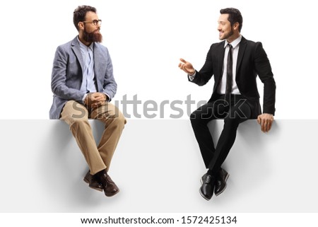 Two men sitting on a panel and having a conversation isolated on white background