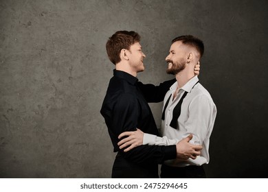 Two men in suits, embracing, against a concrete backdrop. - Powered by Shutterstock