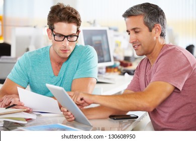 Two Men Using Tablet Computer In Creative Office - Powered by Shutterstock