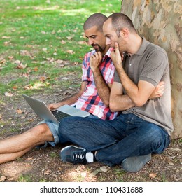 Two Men Working with Computer at Park