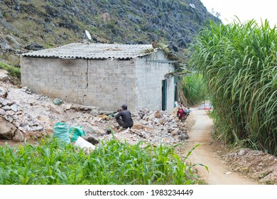 Two Men Working On A Small Building Site In Rural Vietnam