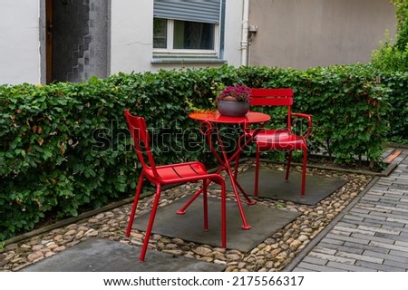 Similar – Image, Stock Photo Red tables, red stools, on them colorful plastic bowls, form a group of round shapes