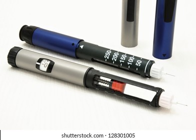 Two Metal Insulin Pen On A White Background