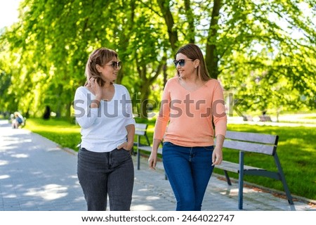 Similar – Image, Stock Photo Two women friends talking happily in sportswear ready to do sports together and support each other.