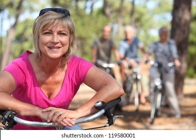 Two Middle Aged Couple On Bike Ride