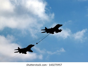 Two Military Aircraft. Refueling In The Air.