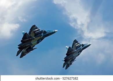 Two Military Aircrafts Flying In The Blue Sky