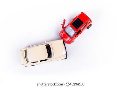 Two Mini Toy Car Crash, Incident, Car Traffic Accident, Frontal Collision Top View, Vehicle Insurance Abstract Concept, Damaged Broken Cars, Cracked Front Light One Door Open, Closeup, Nobody