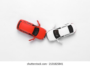 Two Mini Toy Car Crash On White Background, Incident, Car Traffic Accident. Top View