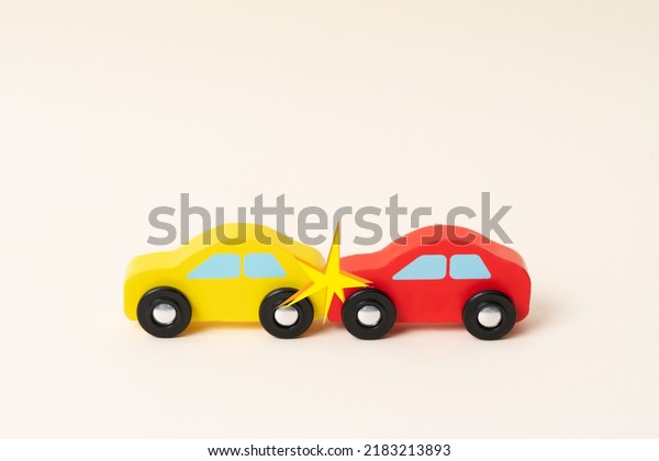 Two mini toy car crash with ambulance\
and police car. Toy car traffic, serious\
accident.