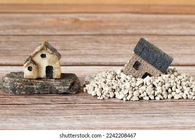 Two miniature houses in sand and on rock (stone). Copy space. A close-up. Solid foundation gospel parable of Jesus Christ, obedience, and faith in God. Christian biblical concept.