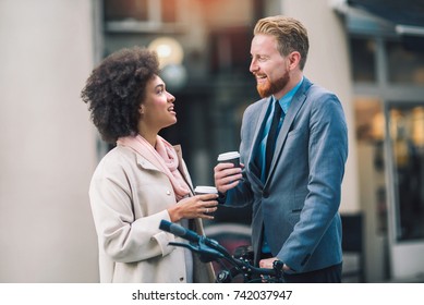 Two Mixed Race Business People Talking Outside Company With Holding Coffee Break Relaxing Time Concept.