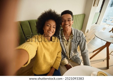 Two mixed race siblings taking a photo together