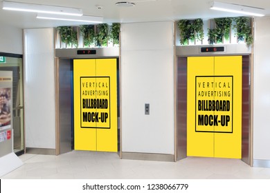 Two mock up vertical blank yellow billboard indoors advertising on doors of elevator cabin with clipping path