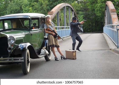 Two models get dressed up in 1930's style 
vintage fashion clothes and act the role of 
the gangster duo Bonnie and Clyde.
