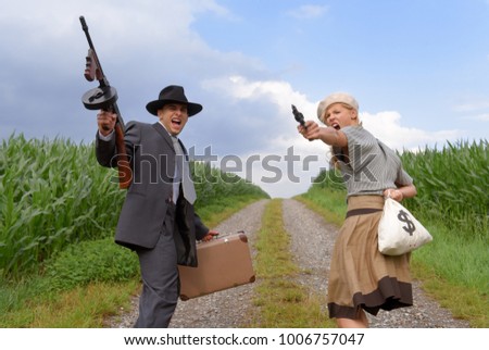 Two models get dressed up in 1930's style 
vintage fashion clothes and act the role of 
the gangster duo Bonnie and Clyde.
