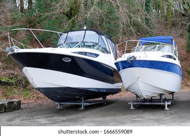 Two Modern Boats Yachts Stored Up In Dry Boat Storage Waiting For Maintenance