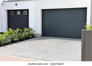 Two Modern New Garage Doors (sectional Doors) In A Residential District