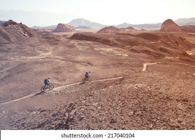 two mountain bikers in the desert - Powered by Shutterstock