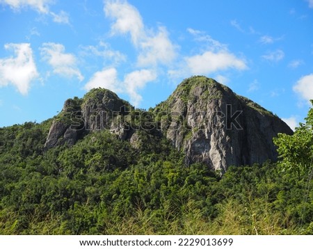 Two mountain peaks located in the municipality of Salinas, Puerto Rico. Cerro Las Tetas, nicknamed Las Tetas de Cayey but officially Las Piedras del Collado