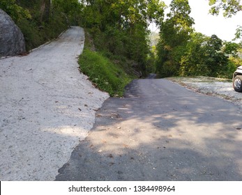 Two Mountain Roads, One Asphalt Road And One Cement Make Road, Merging Together On A Mountain Forest.