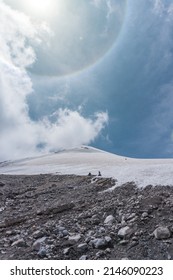 Two Mountaineers Walking On The Ice