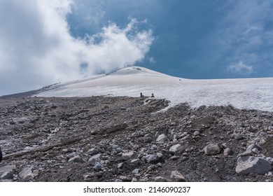 Two Mountaineers Walking On The Ice