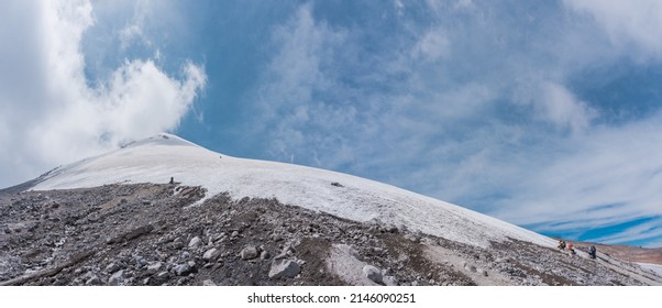 Two Mountaineers Walking On The Ice