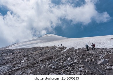 Two Mountaineers Walking On The Ice