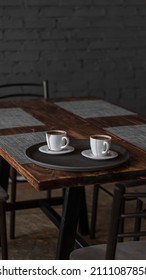 Two Mugs Of Coffee Stands On A Tray In A Restaurant.  Dark Colors, Loft Style Interior.  No People