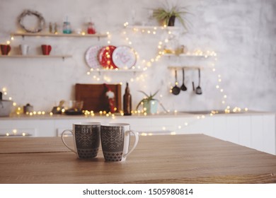 Two Mugs Of Tea Stand In The Kitchen On The Table