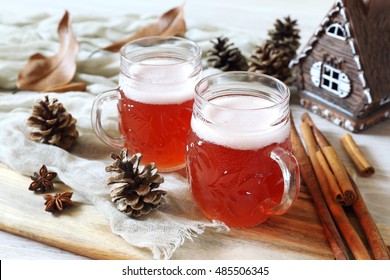 Two Mugs Of Winter Craft Beer In  New Year Decorations