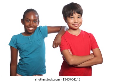 Two multi racial school kids, boy and girl wearing blue and red t-shirts against white background, showing happy smiles from pair of friends.
