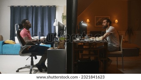 Two multiracial men sit in front of computers in bedrooms, talk via online video call, have video conference. View of two rooms or apartments separated by wall. Concept of neighbourhood and lifestyle.