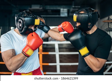 two muscle boxers sport man training and fighting on boxing ring at gym